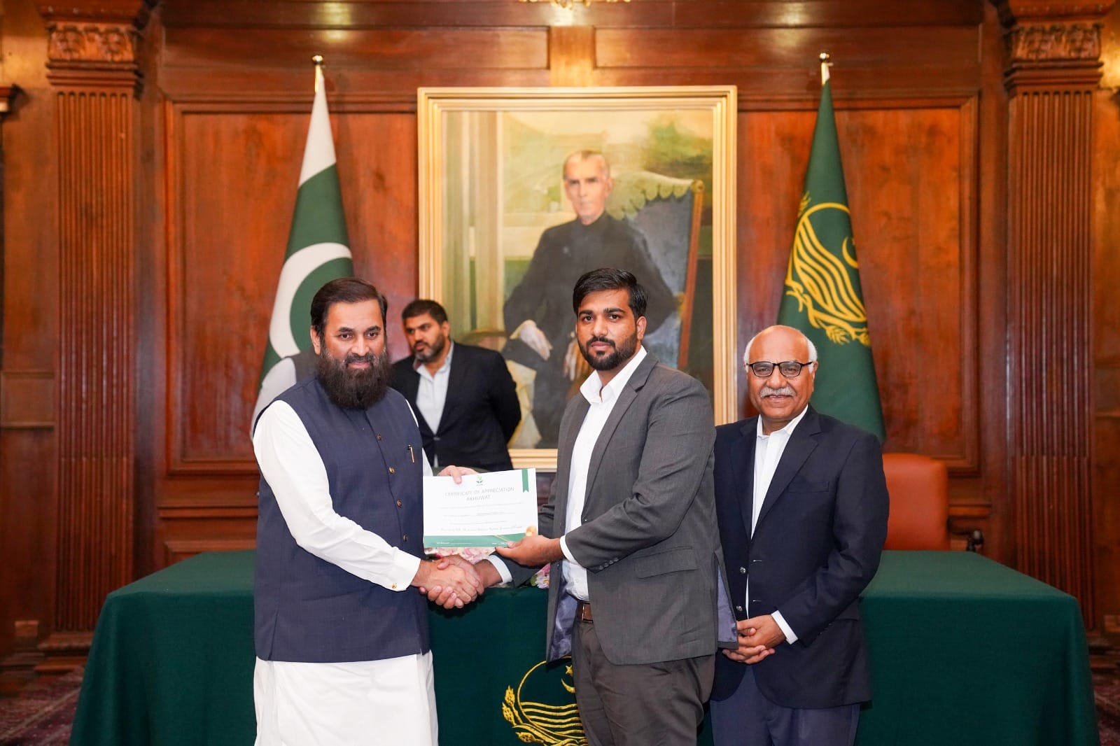 receiving certificate of appreciation from Governor Punjab for my services as a Digital Marketing Trainer
